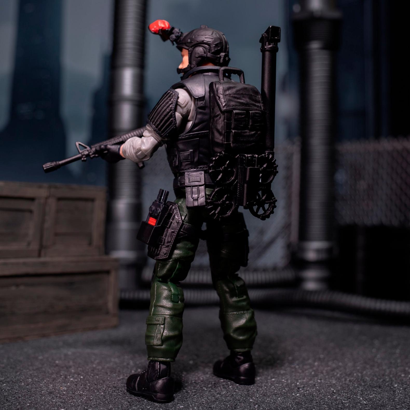 Rear view of Night Force Sneak Peek tactical backpack and weapons